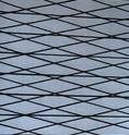 A close up of the wire mesh on a window.