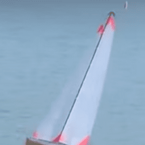 A white and red boat in the water.